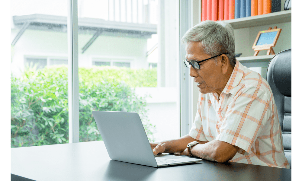 man searching medical condition on laptop