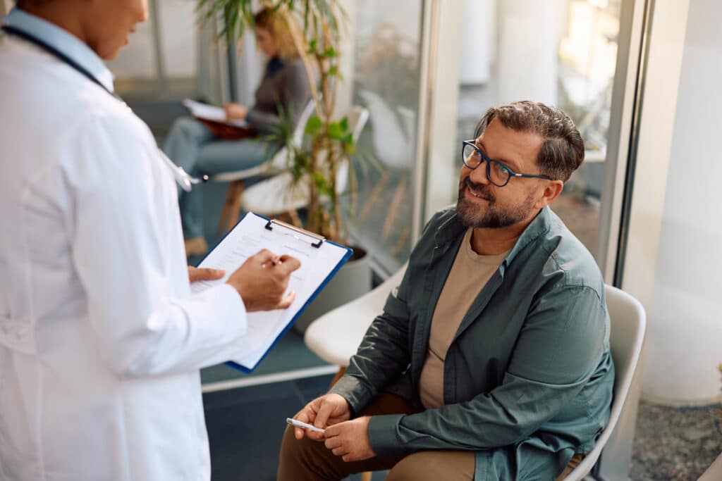 mature man talking with his doctor during a medical consultation
