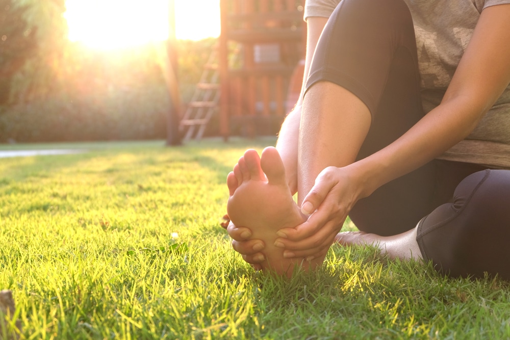 Woman with diabetes checking her feet woman with diabetes checking her feet